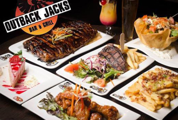 Selection of Meals Served at Outback Jacks Including Steak and Ribs